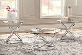 This round coffee table is ideal for setting the stage at home. Hollynyx Table Set Of 3 Ashley Furniture Homestore