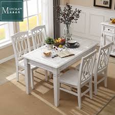 If you find yourself gravitating towards square or rectangular dining tables, give this circular table its shining moment. Wooden Fish Furniture American Solid Wood Dining Table White Simple Small Apartment Dining Table Retro Distressed