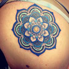 A dragon tattoo design on fullback of a man is looking awesome inside a mandala tattoo design. Pin By Crystal Styles On Tattoos Mandala Tattoos For Women Mandala Tattoo Design Mandala Flower Tattoos