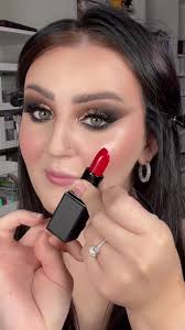 Achieve Stunning Makeup Looks with Red Lipstick and Purple Eyeliner