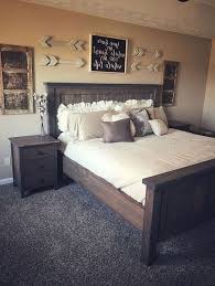 Rosy colors repeat in the area rug, bedding, table lamp, and pillows. Rustic Farmhouse Master Bedroom Ideas Design Corral