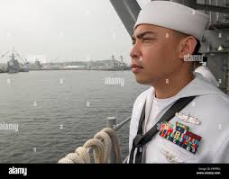 SAN DIEGO (July 24, 2018) U.S. Navy Rear Adm. Dave Welch, commander,  Combined Task Force (CTF) 177 and Naval Surface and Mine Warfighting  Development Center (SMWDC), left, speaks with U.S. Coast Guard