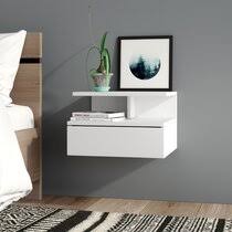 It is usually a small table and may have a drawer, cabinet, a combination of drawers and cabinets, or be a very simple table. Corner Bedside Table Wayfair Co Uk