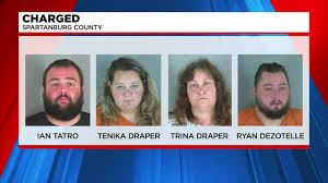 Four charged with child abuse