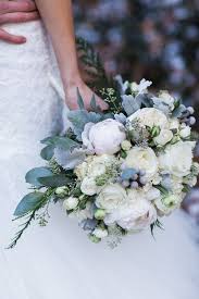 Classic white wedding bouquets will never go out of style. Glamorous Winter Wedding With Gold And Silver Hues Winter Wedding Flowers Wedding Flowers Winter Wedding Bouquet
