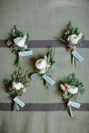 Rustic Modern Boutonnieres Ranunculus And Evergreens Fleurie Flower Studio Www Fleurieflower Com Pho Boutonniere Wedding Wedding Flowers Wedding Bouquets