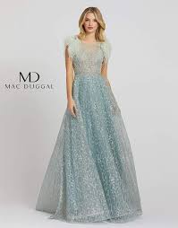 He prides himself on knowing that today's modern woman is dynamic and deserves a style that reflects that. Mac Duggal The Dress Outlet