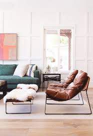 Select from a plethora of leather or fabric options to make a statement in your living space. White Wainscoting Wall Detail Abstract Art Over The Sofa Green Sofa Leather Accent Chairs And Accent Chairs For Living Room Living Room Chairs Green Sofa