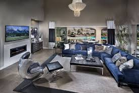 Expansive Open Living Room On Grey Tile Flooring Features Lengthy Blue Fabric Sectional Sofa And Chrome B Silver Living Room Living Room Grey Blue Living Room