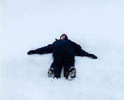 Fond Du Lac Adults Enjoy Snow By Making Snow Angels Snowmen