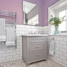 Darker shades are dramatic and bring depth, they are very popular for trendy moody spaces, and lighter shades bring a restful feel to the space but without being too cold as some blues, so using them for a bathroom is a great idea. Lilac And White Bathroom Makeover With Metro Tiles And Shower