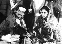 A piercing stare, right back at the audience sitting inside our cocooned,  blind darknesses. From Ketan Mehta's 1980 Gujarati film, Bhavni Bhavai. A  tale narrated in the manner of a folklore, a