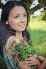 Young Girl Holding Clover Bouquet Stock Photos