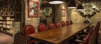 Wine storage appears to be floating by using a cable suspension system and provides a premium view of the stone walls behind. Wine Room Brennan S Restaurant A New Orleans Tradition Since 1946
