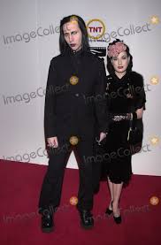 This page is about nicolas cage marilyn manson,contains marilyn manson is slowly turning in. Photos And Pictures Marilyn Manson And Dita Von Teese At The American Cinematheque Award To Nicolas Cage Beverly Hilton 10 28 01