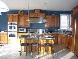 Wall colors that were the most popular with medium walnut stained cabinets were more golden beige. Trust Your Gut Or Ask The Expert Blue Kitchen Walls Paint For Kitchen Walls Kitchen Colors
