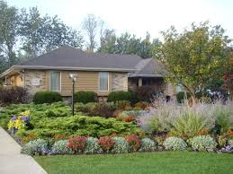 When choosing between the options for front yard landscaping, begin within a plan that sets priorities. Tips To Landscaping With Ranch Style Home Interior Decorating Colors Yard Landscaping Landscaping Ranch Style Homes Front Yard Landscaping Pictures