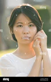 Happy asian light ray hi-res stock photography and images