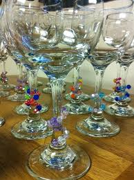 Carefully coat the base of each wine glass with chalkboard paint. Wire And Beads Wrapped Around Wine Glass Stem Different Colors For Different Holidays Think Green A Homemade Wine Glass Wine Glass Charms Wine Glass Markers