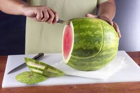 First Step To Make Football Helmet Out Of Watermelon Football Birthday Party Superbowl Party Food Watermelon Carving