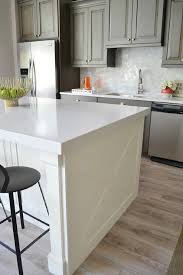 Enclosing a refrigerator with wood end panels and a cabinet on top. Kitchen Cabinet End Panel Organizer Design Ideas