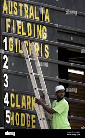 A scoreboard keeper works