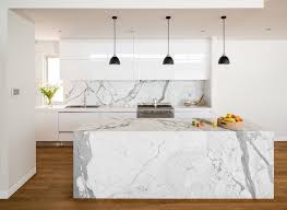 A black minimalist kitchen with sleek cabinets. Polished Panache Transform Your Kitchen Island With Marble Magic