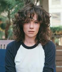 Poker face curly hairstyle focuses on showcasing your fringe hair. Curtain Bangs With Short Curly Hair Novocom Top
