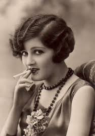 Young girl smoking a cigar in Victorian ad