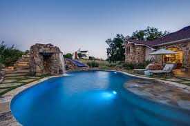 Search for backyard luxury pools at searchandshopping.org. Stone Oasis Luxury Swimming Pool With Grotto And Slide Dallas Tx Rustic Swimming Pool Dallas By One Specialty Landscape Design Pools Hardscape Houzz