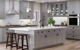 Pictured above on maple cabinets, pebble grey's lighter hue pairs well with almost any color and works well in modern kitchen designs. Ideal Cabinetry Tiverton Pebble Gray Home Magic Llc