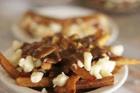 Poutine is an absolutely divine dish composed of fries topped with cheese curds and hot gravy. First Time In Canada 5 Canadian Foods You Have To Try