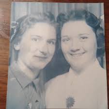 This is a photo of Jackie Cronin and myself when we graduated from Lowell  in June 1957 along with class picture.. Jackie 's Mother and my Father  graduated from Lowell in the
