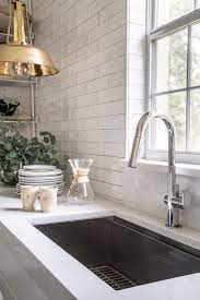 You'll also find many examples of mosaic tile, stone, glass, and marble backsplashes. A Florida Designer Reinvents Her Kitchen By Removing The Upper Cabinets Kitchen Remodel White Subway Tiles Kitchen Backsplash Kitchen Renovation