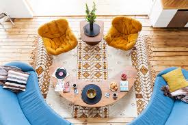 Centre modern furniture around a cubic rug. 10 Ways To Decorate Your House Like The 1970s Without Making It Feel Dated