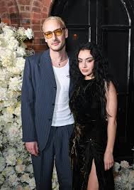 Meet Charli XCX's fiancé George Daniel, The 1975's drummer: Matty Healy's  bandmate helped the singer with her Brat campaign and, like Taylor Swift,  went to Jack Antonoff and Margaret Qualley's wedding |