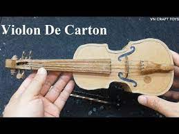 Following that, push your pegs into the holes. Violin De Carton How To Make Violin From Cardboard Youtube Violin Diy Violin Toy Violin