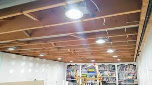This will give the illusion of a window or even a door that leads outside, while adding another source of light and interest to the room. Let There Be Lights Basement Renovation Update Organizing Homelife Basement Lighting Basement Renovations Installing Recessed Lighting