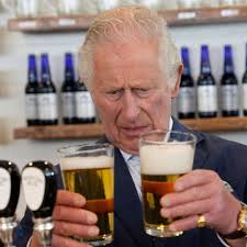 Prince Charles and Camilla pull pints ...