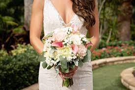 In this video, we've put together the perfect video of beach wedding bouquets from some of our recent weddings. Florida Bride Holding Romantic Tropical Wedding Bouquet Blush Pink Florals White Flowers Wearing Hayley Paige Wedding Dress Marry Me Tampa Bay Most Trusted Wedding Vendor Search And Real Wedding Inspiration Site
