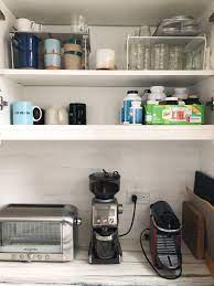 You can also install hooks under your cabinets or under shelves for hanging mugs. How To Organize Your Kitchen Cabinets And Pantry Feed Me Phoebe