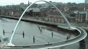 The gateshead millennium bridge is a pedestrian and cyclist bridge spanning river tyne in england between gateshead's quays arts quarter on the south bank, and the quayside of newcastle on the north bank. Gateshead Millennium Bridge