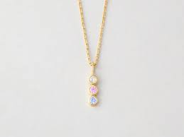 This cascading gemstone pendant is beautiful in both gold and silver. Birthstone Necklace For Mom Centime Gift