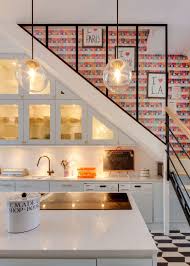 Two Apartments In Paris To Make You Jealous Miss Moss Kitchen Under Stairs Stairs In Kitchen Kitchen Lighting Design