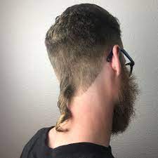 Man With Short Hair And Curly Rattail Mullet Hairstyle Mullet Haircut Hairstyle