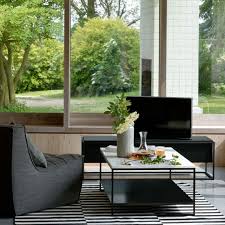Tessellated stone tables.with their sculptural stone bases and glass table tops, the tables might just be the neutral statement piece your living room is missing. Ethnicraft Stone Coffee Table Adventures In Furniture