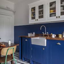 A Striking Colour Scheme And Patterned Floor The Perfect Ingredients For A Kitchen Featured Within The Latest Hous Blue Kitchens Kitchen Half Painted Walls
