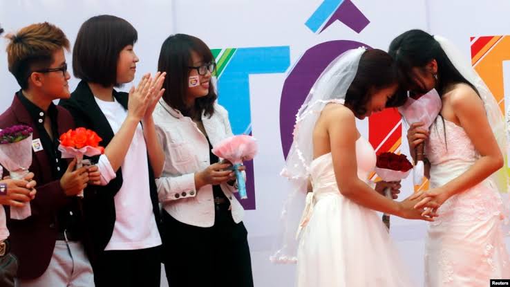 Same-sex wedding ceremony in Vietnam, AI generated