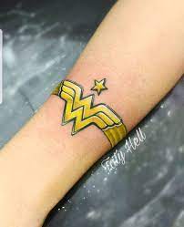 An ultimate guide on small wrist tattoo ideas for men women (august 2021). Very Cool Wonder Woman Tattoo Arm Band Tattoo Cuff Tattoo