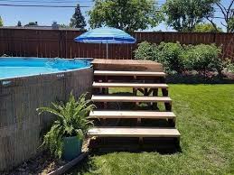 24 Above Ground Pools You Ll Want In Your Backyard Above Ground Pool Landscaping Backyard Pool Landscaping Pool Steps